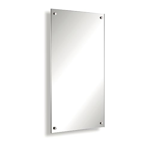 Miroir chauffant infrarouge Könighaus vert, sans cadre, installé au mur dans une salle de bain lumineuse.