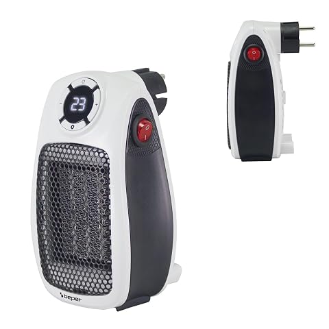 Mini radiateur soufflant céramique blanc Beper branché au mur dans une salle de bain lumineuse